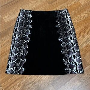 Vintage Y2K Metro Style black leather and silver snakeskin design skirt. Size 16